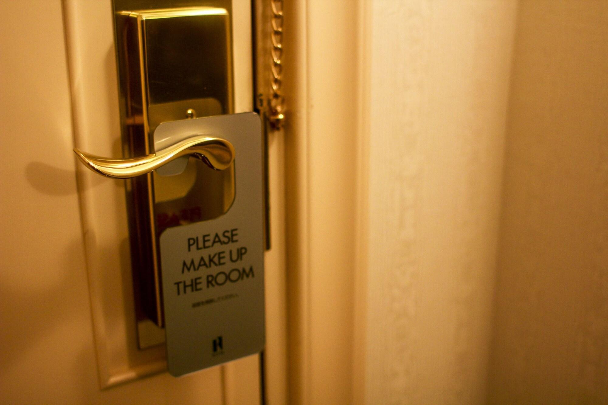 Royton Sapporo Hotel Экстерьер фото A door sign requesting a maid service